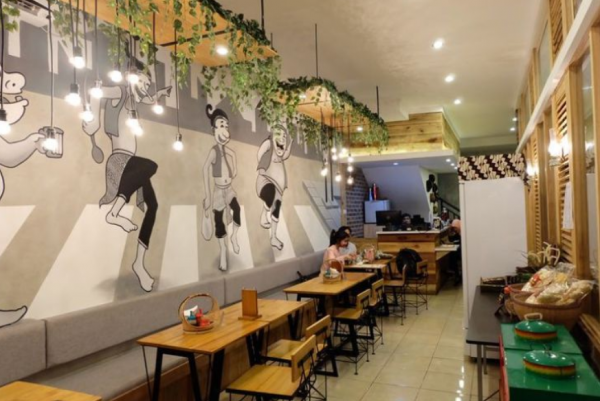 Cafe dengan desain minimalis dan warna monokrom untuk kesan modern dan elegan